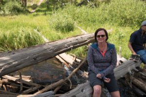 Woman before quitting alcohol sitting on branch