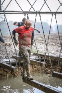 man running in mud