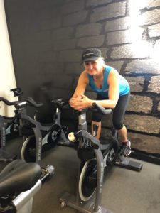 woman quits alcohol on exercise bike