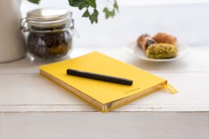 note pad and pen on table